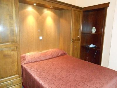 Postel nebo postele na pokoji v ubytování Hotel IL Castellino