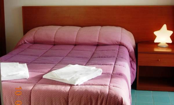 Łóżko lub łóżka w pokoju w obiekcie Casa Vacanze Elianto