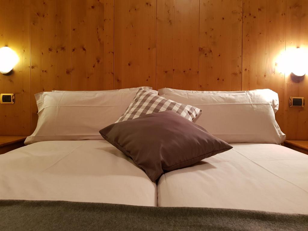 Postel nebo postele na pokoji v ubytování Hotel Cima Piazzi