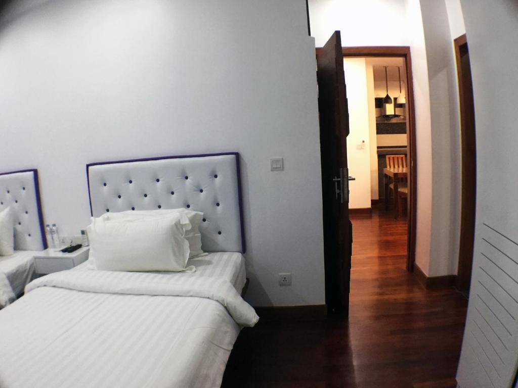 Postel nebo postele na pokoji v ubytování Zita Angkor Hotel