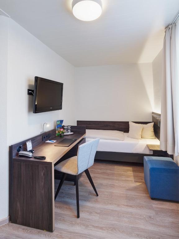 Postel nebo postele na pokoji v ubytování Art Hotel Aachen