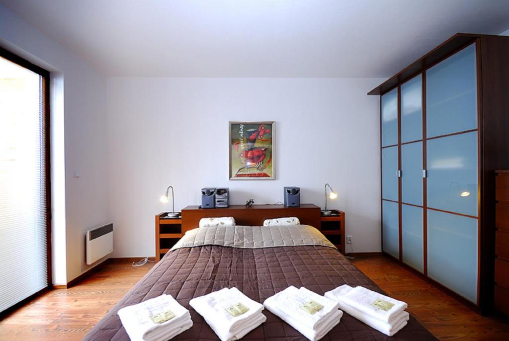 Postel nebo postele na pokoji v ubytování Ski & Sun Wellness Apartments