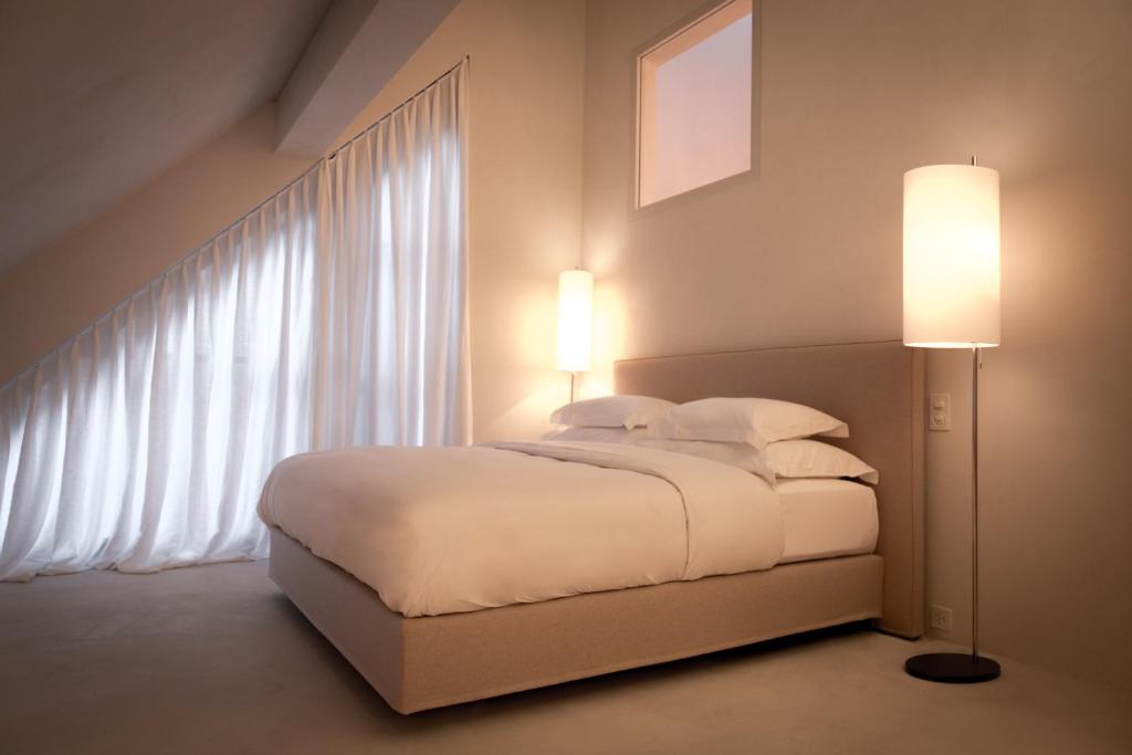 Postel nebo postele na pokoji v ubytování Hotel Krone Regensberg