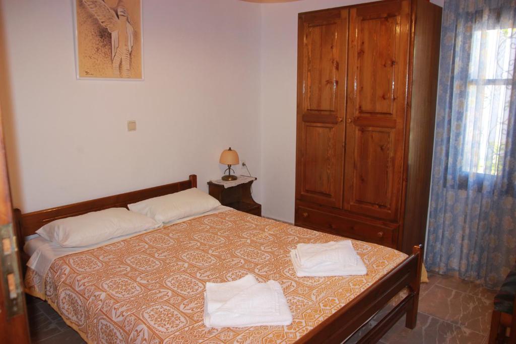 Posteľ alebo postele v izbe v ubytovaní Tasos Cottages