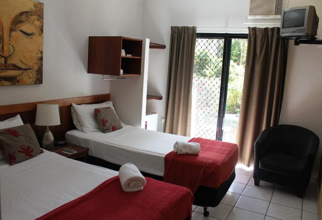 Postel nebo postele na pokoji v ubytování Bohemia Resort Cairns