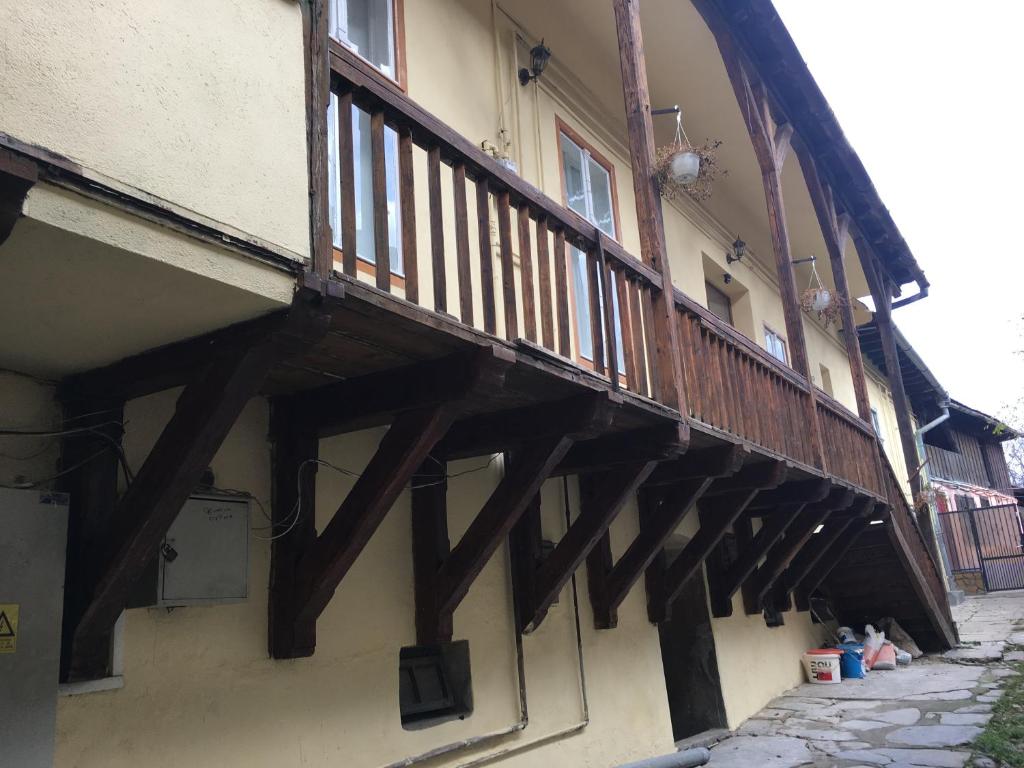 a wooden balcony on the side of a building at Anastasia in Mediaş