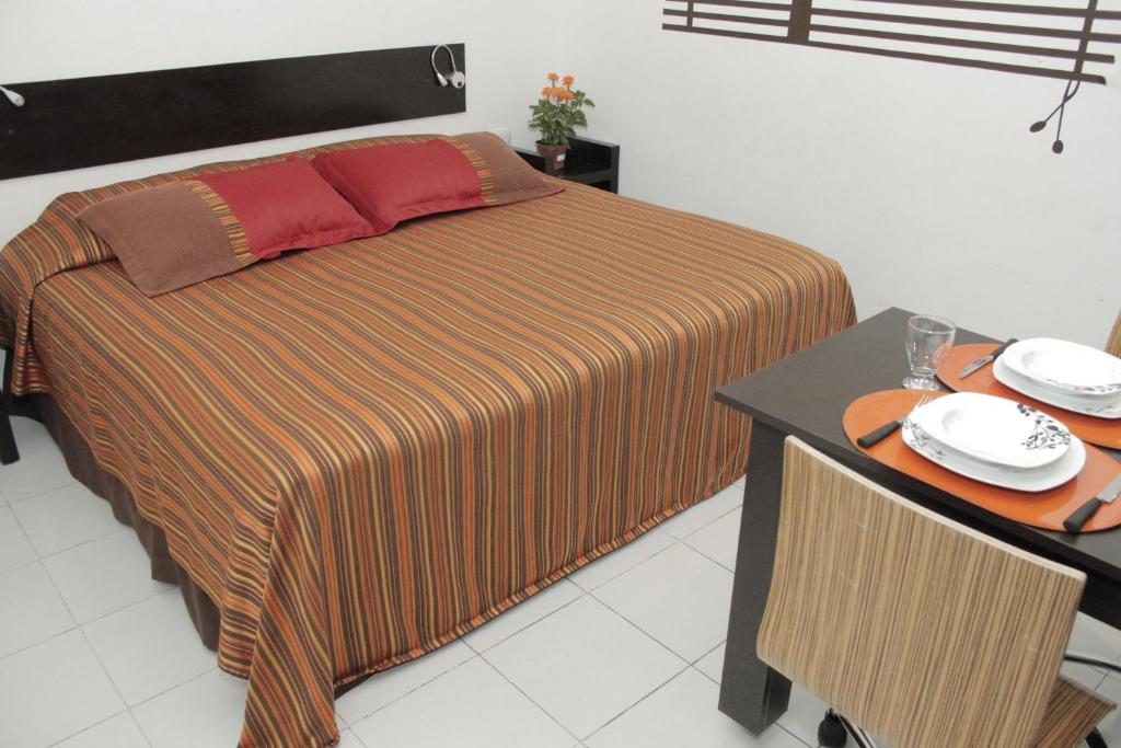 Postel nebo postele na pokoji v ubytování Aparthotel Siete 32