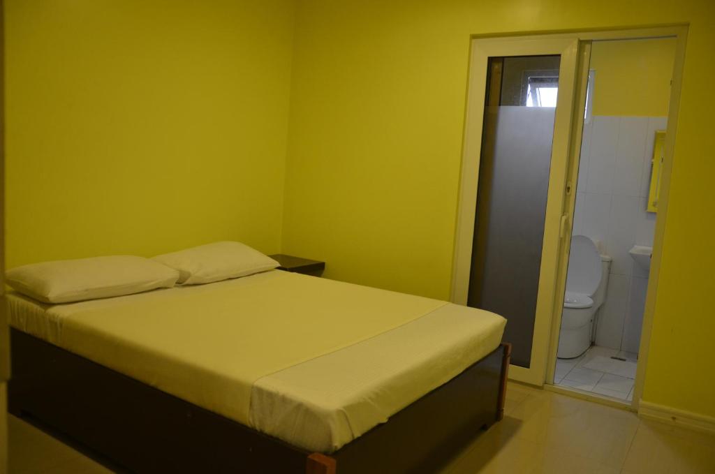 Postel nebo postele na pokoji v ubytování RL Veranda Suite