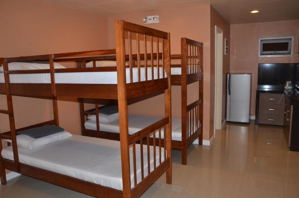 Postel nebo postele na pokoji v ubytování RL Veranda Suite