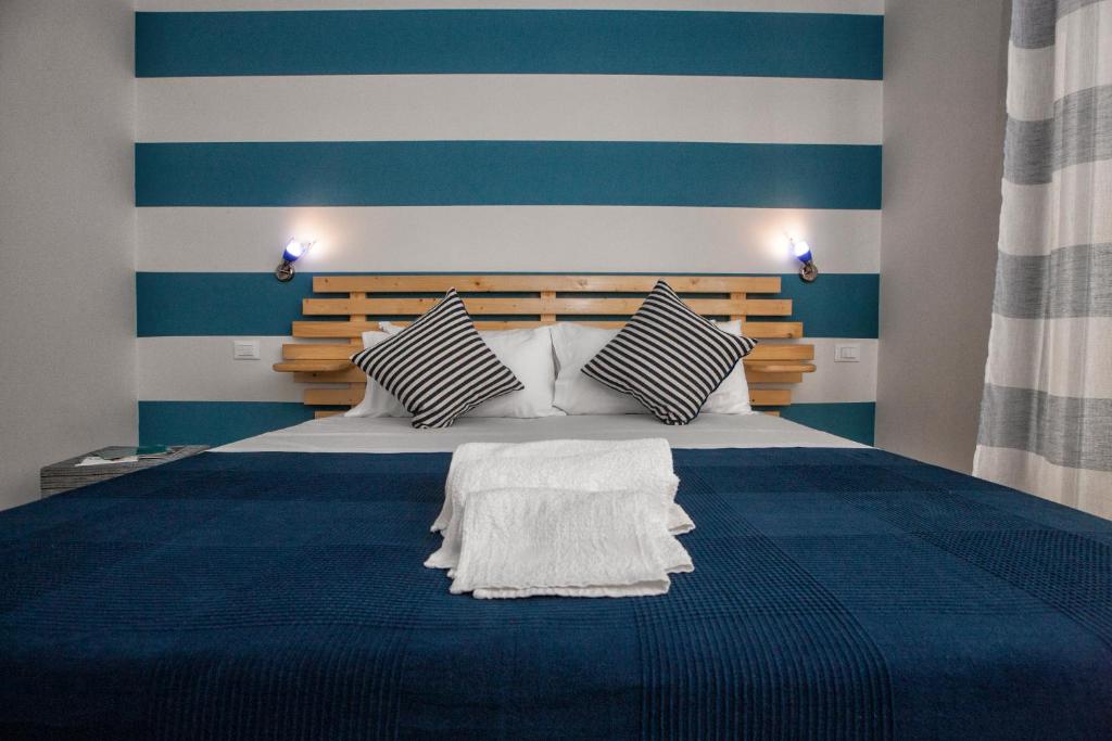 A bed or beds in a room at B&B Kalavrìa