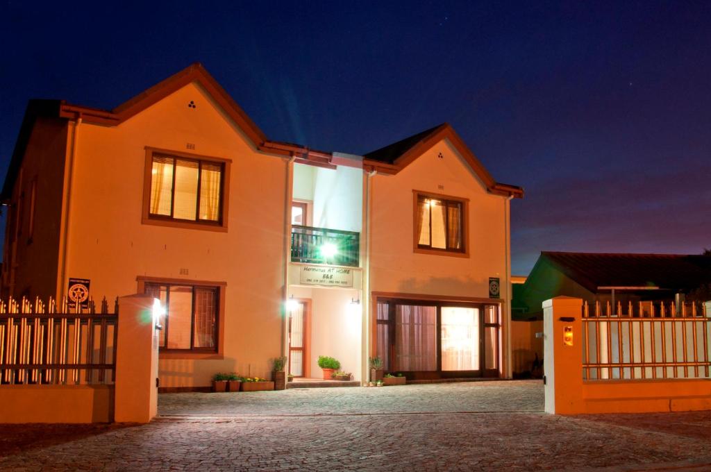 a house at night with the lights on at Hermanus AT HOME in Hermanus