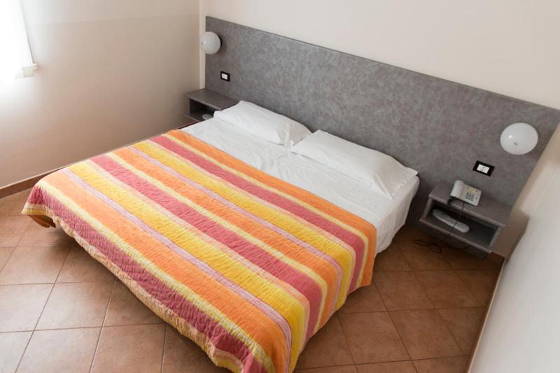 Postel nebo postele na pokoji v ubytování AutoHotel