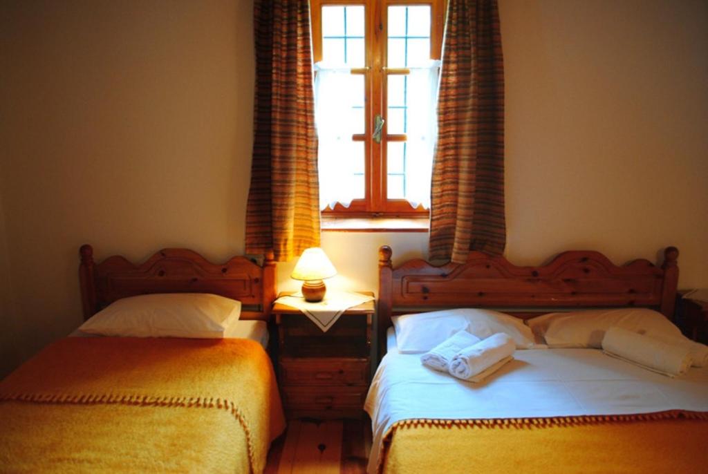 Postel nebo postele na pokoji v ubytování Hotel Kaiti