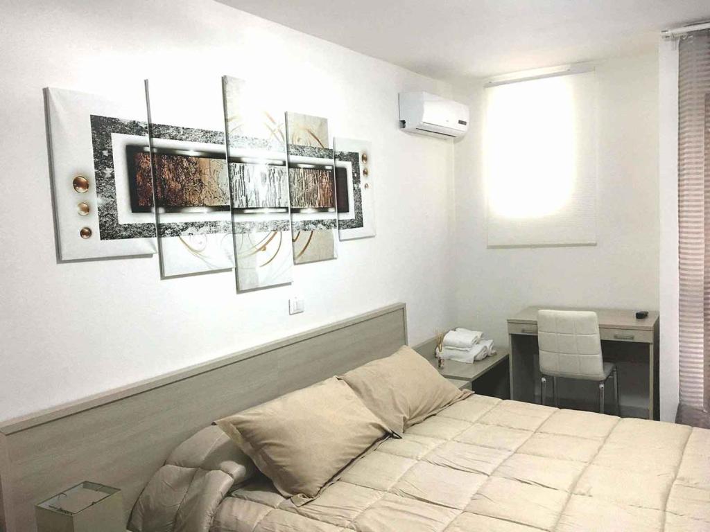 Postel nebo postele na pokoji v ubytování Residence R&B Tyrrhenum
