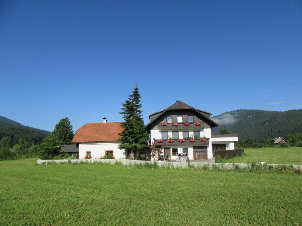 a large house in the middle of a field at Ferienhaus Santner in Tamsweg