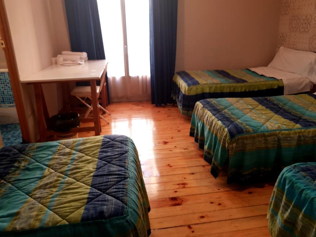 Posteľ alebo postele v izbe v ubytovaní Hostal Padre Isla 1