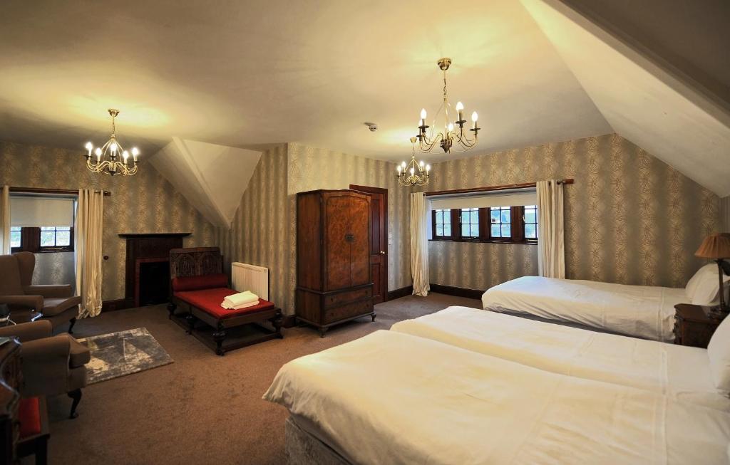 A bed or beds in a room at St Michaels Guest House
