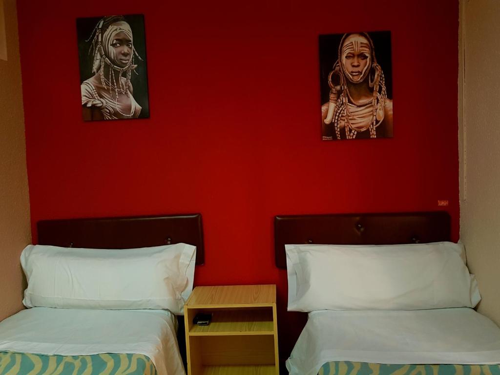 Posteľ alebo postele v izbe v ubytovaní Hostal Padre Isla 1