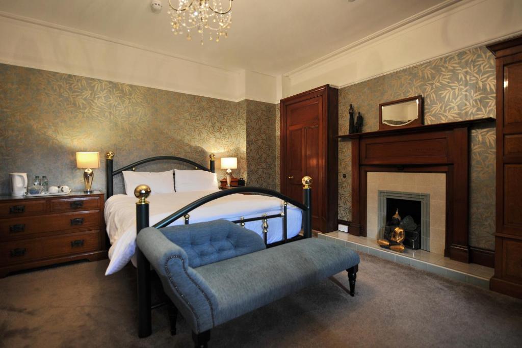 A bed or beds in a room at St Michaels Guest House