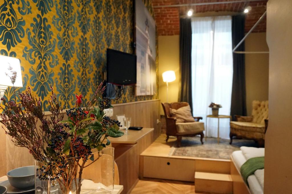 TV a/nebo společenská místnost v ubytování WANZ'inn Design Appartements