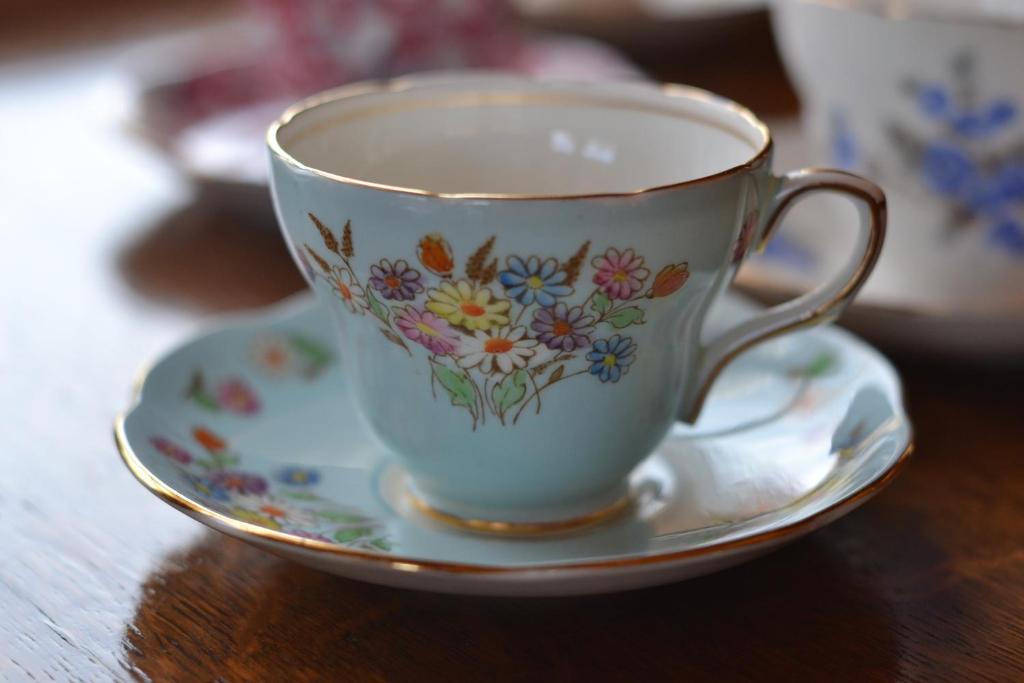 a coffee cup on a plate on a table at Polan no Fue in Minamioguni