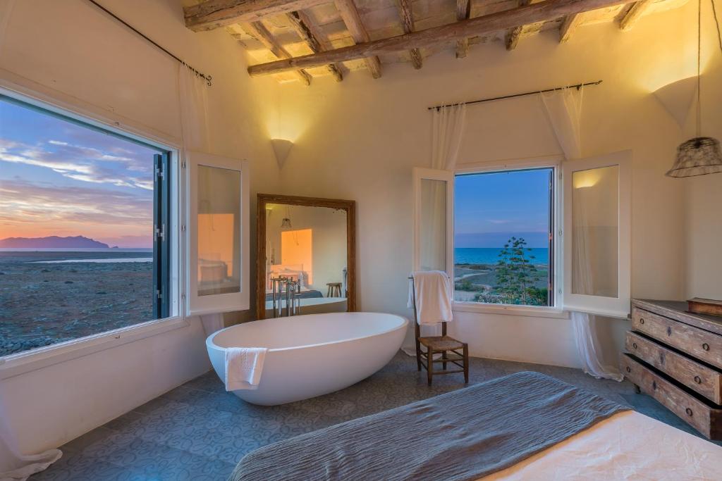 Letto o letti in una camera di Dimora Cala del Pozzo