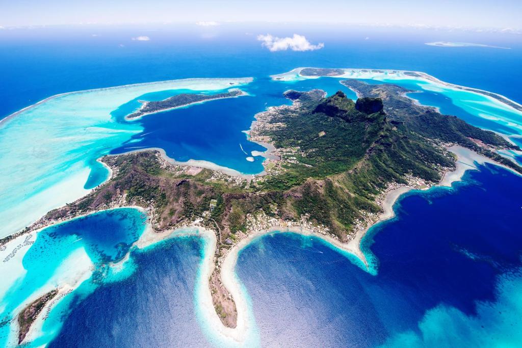 an aerial view of an island in the ocean at Village Temanuata in Bora Bora