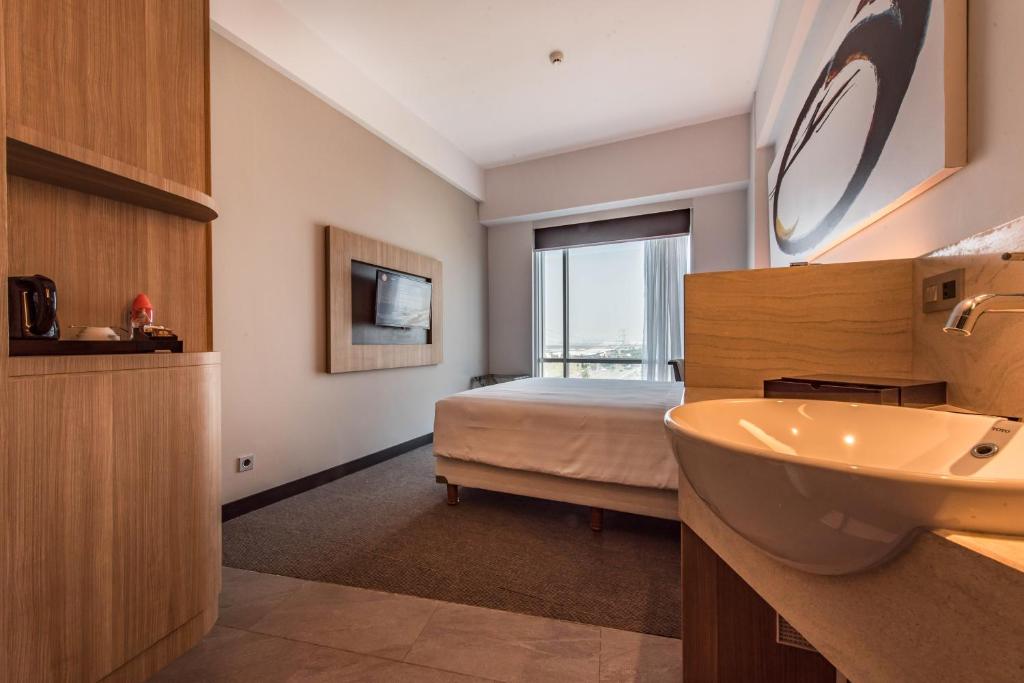 Postel nebo postele na pokoji v ubytování Enso Hotel