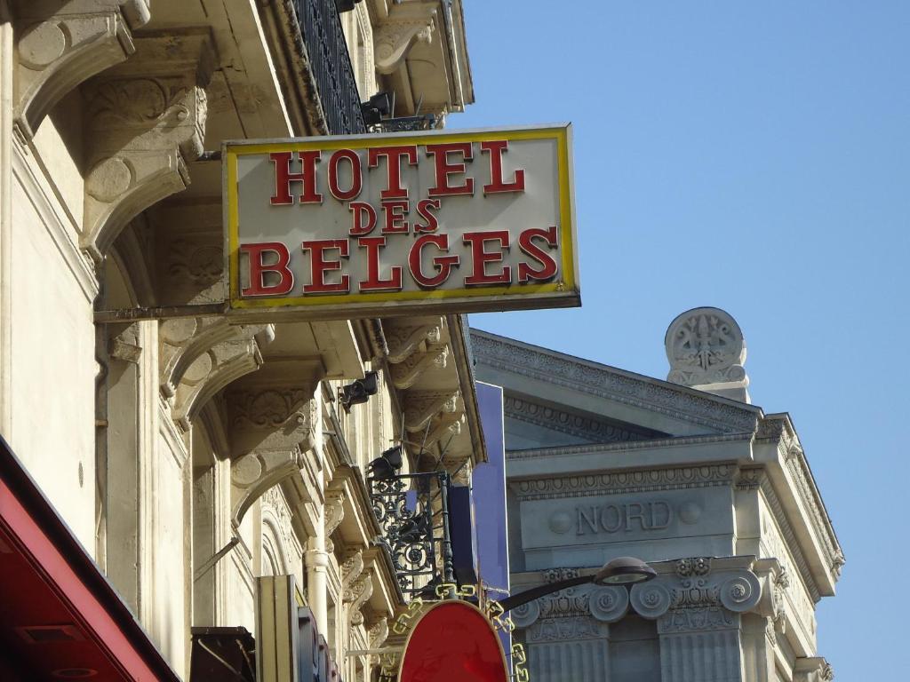 a hotel sign on the side of a building at Hotel des Belges in Paris