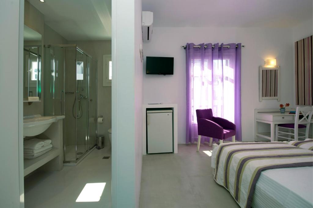 Postel nebo postele na pokoji v ubytování Kalypso Hotel
