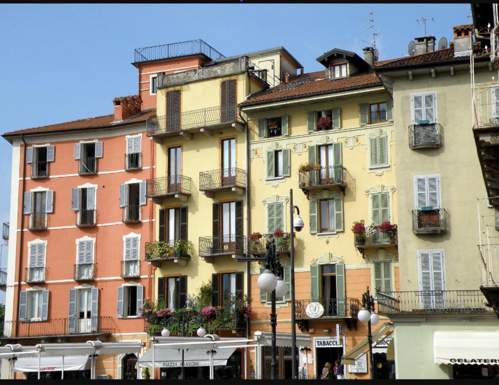 a group of buildings with flower boxes on them at Ranzoni 3 sub. 1 in Verbania