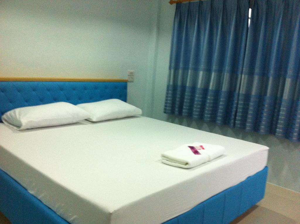 Postel nebo postele na pokoji v ubytování เคียงเลิงรีสอร์ท