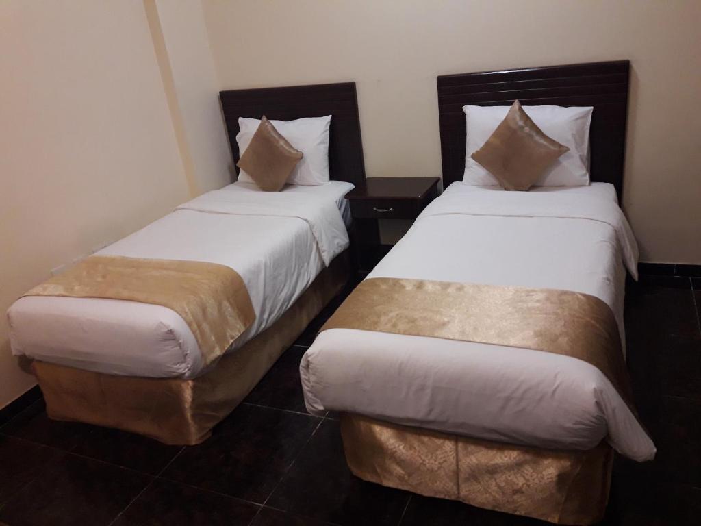 Postel nebo postele na pokoji v ubytování Lake Hotel