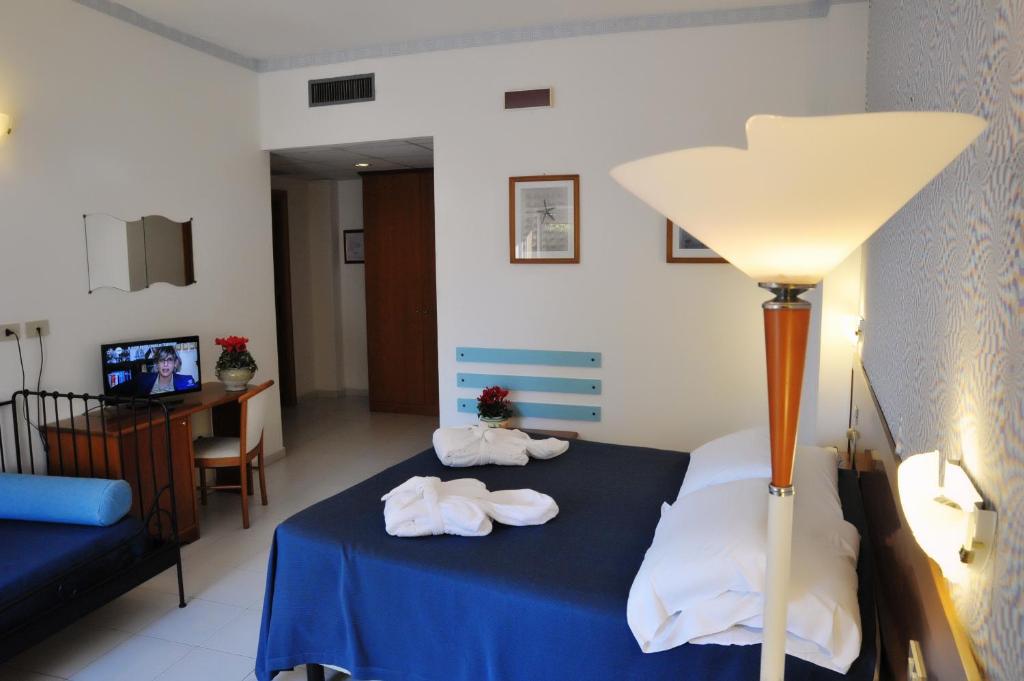 Postel nebo postele na pokoji v ubytování Villa Dei Principi Hotel