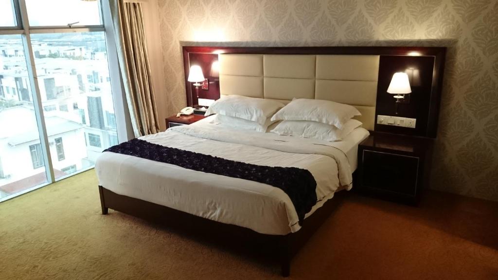 Postel nebo postele na pokoji v ubytování Pariss Hotel