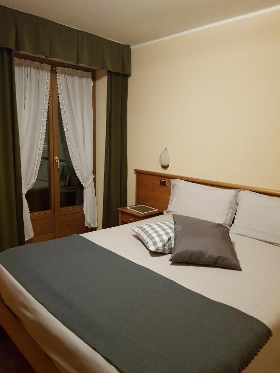 Postel nebo postele na pokoji v ubytování Hotel Cima Piazzi