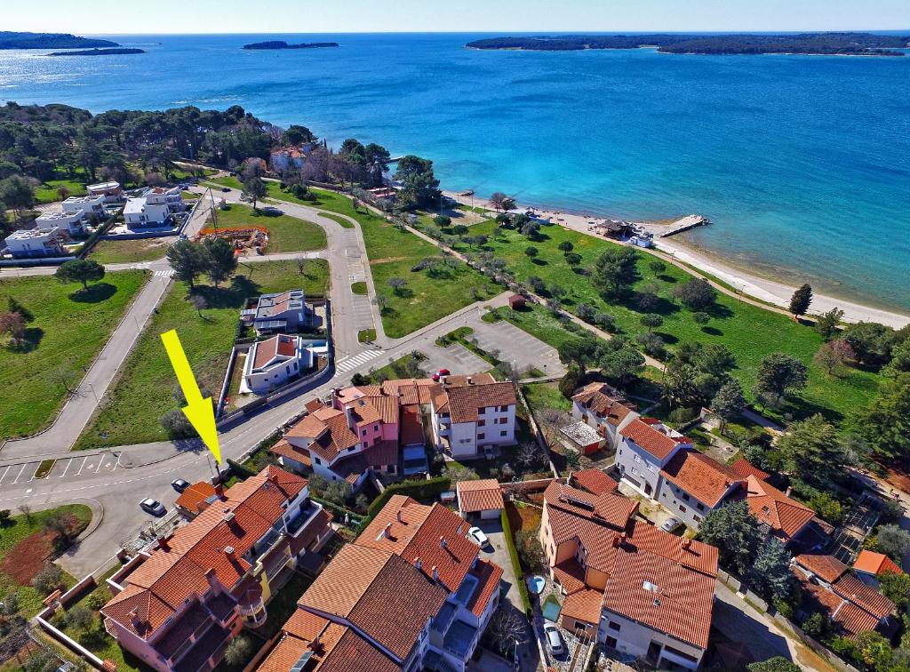 an aerial view of a town next to the ocean at Apartments Ozren 311 in Fažana