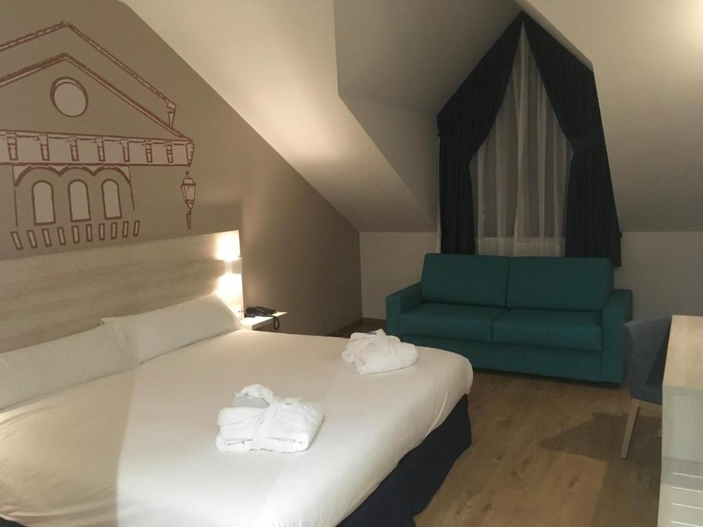 Postel nebo postele na pokoji v ubytování Hotel Balneario de Graena
