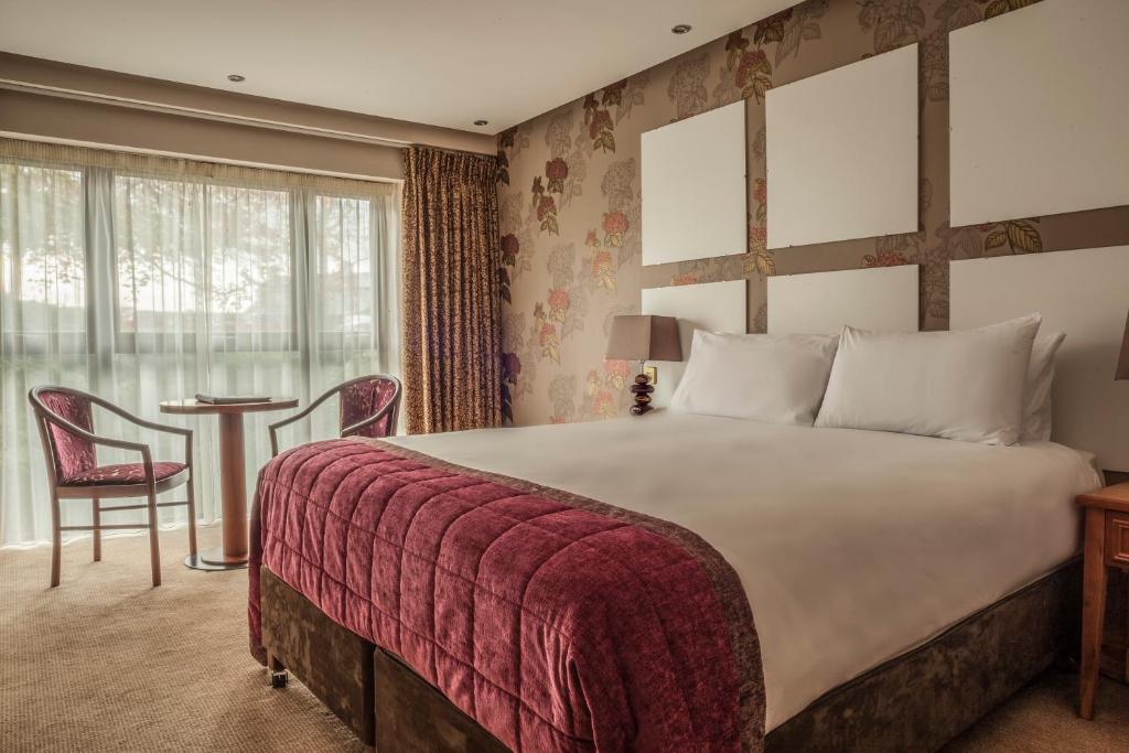 Postel nebo postele na pokoji v ubytování Westport Woods Hotel & Spa