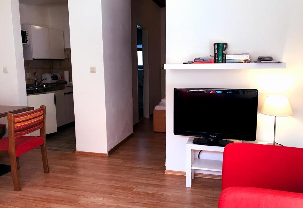 TV a/nebo společenská místnost v ubytování Sonntagshof Ferienwohnungen Apartments