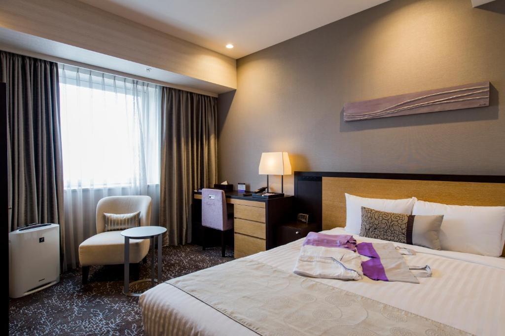 Postel nebo postele na pokoji v ubytování Hotel Ole