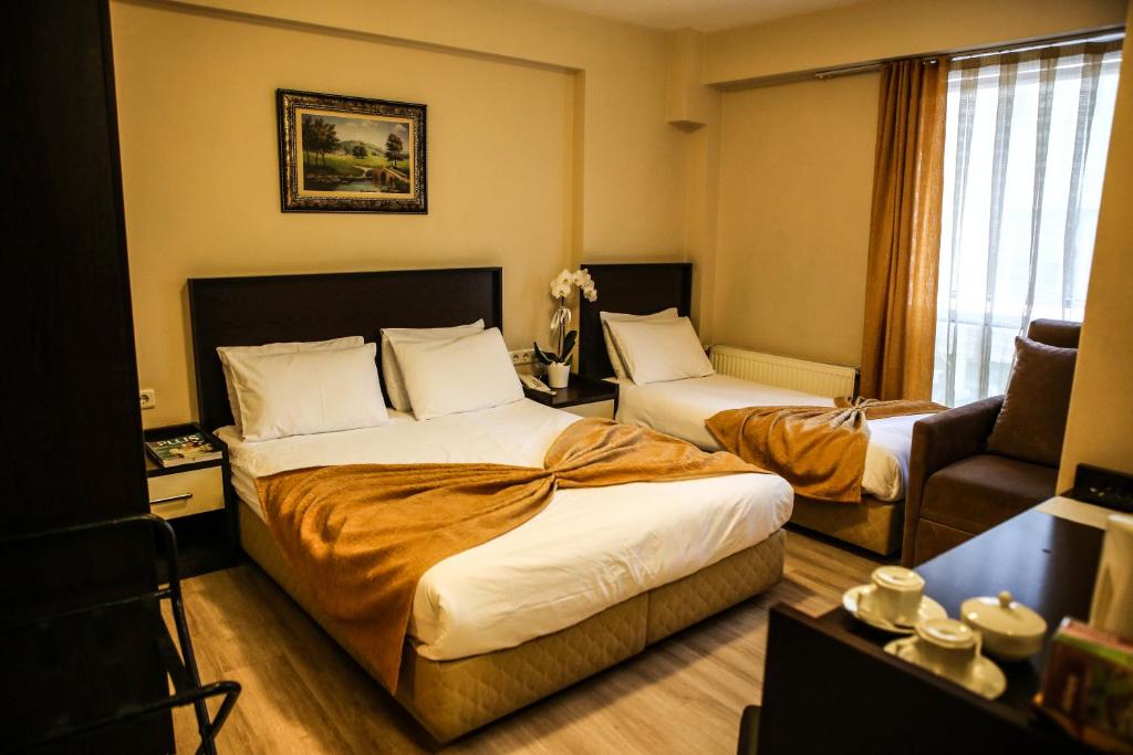 Postel nebo postele na pokoji v ubytování Canakkale Bogaz Hotel