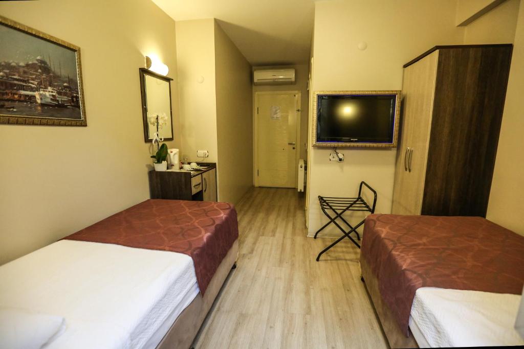 Postel nebo postele na pokoji v ubytování Canakkale Bogaz Hotel