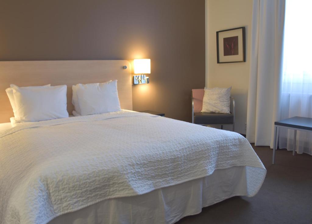 Postel nebo postele na pokoji v ubytování Hotell Charlottenberg
