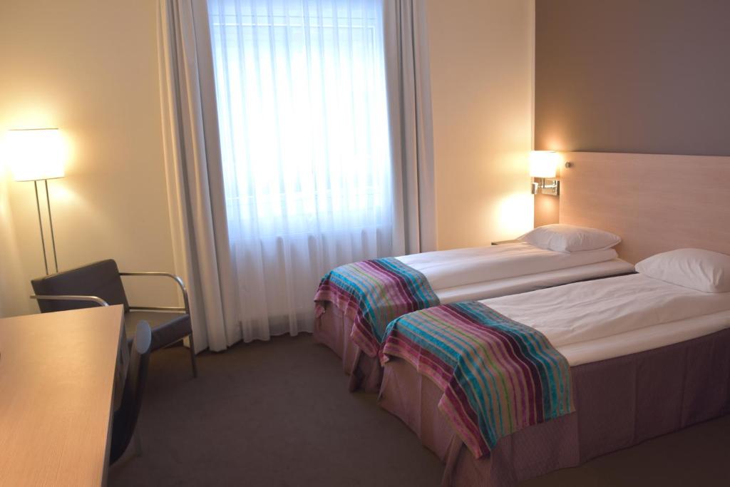 Postel nebo postele na pokoji v ubytování Hotell Charlottenberg