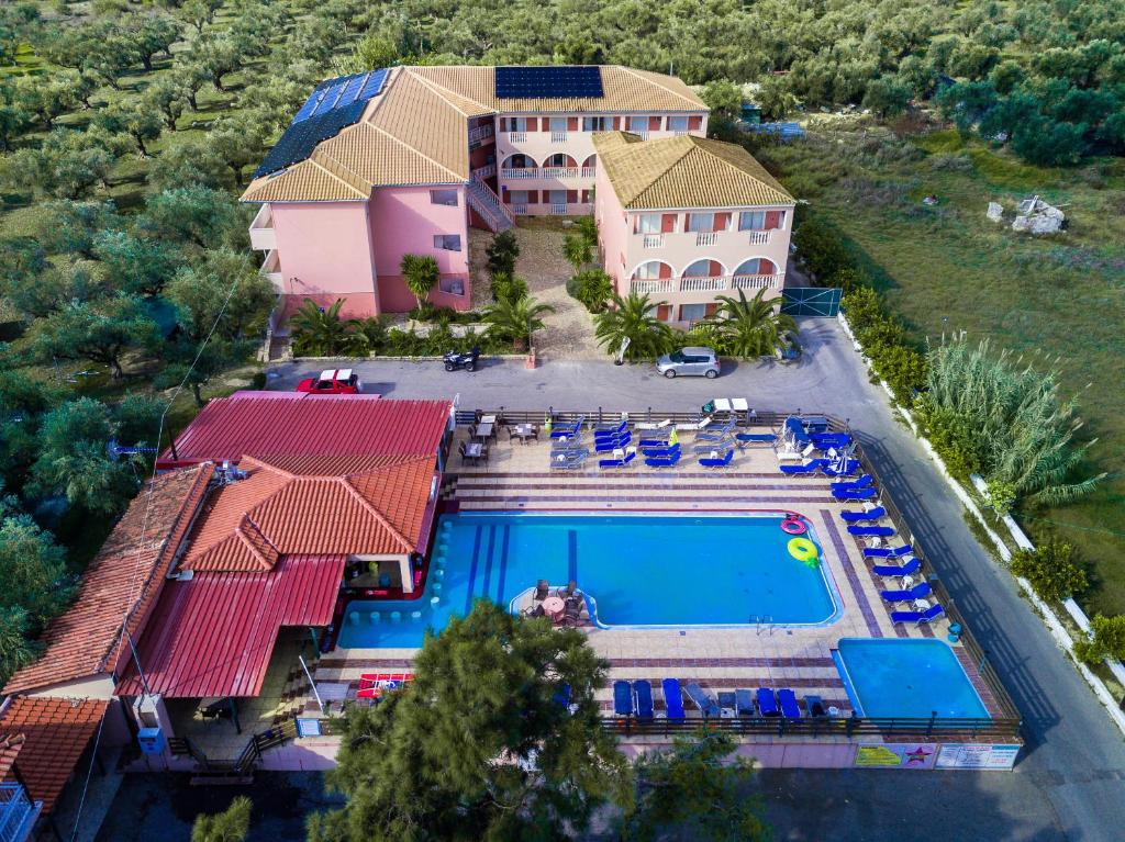 an aerial view of a house with a swimming pool at Savvas-Demar Hotel in Laganas