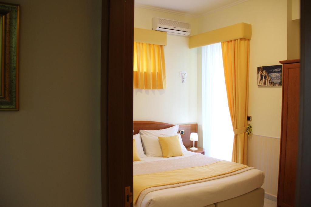 Postel nebo postele na pokoji v ubytování Villa Julia