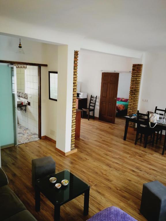 a living room with a couch and a table at Ca' Vaschino in Granada