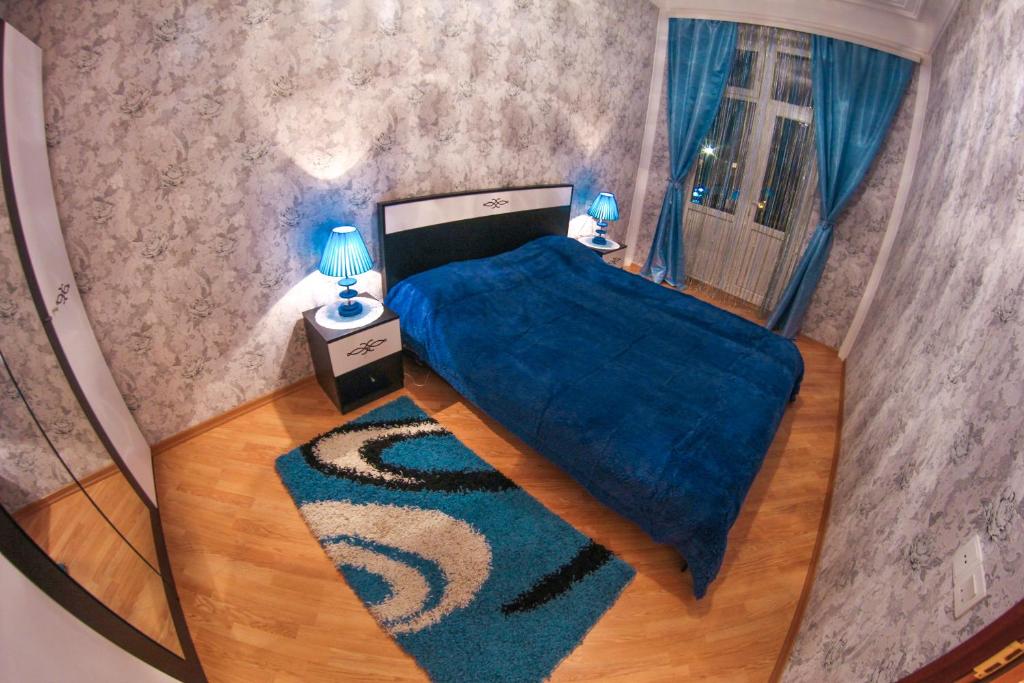 Ένα ή περισσότερα κρεβάτια σε δωμάτιο στο OLIMP Apartment