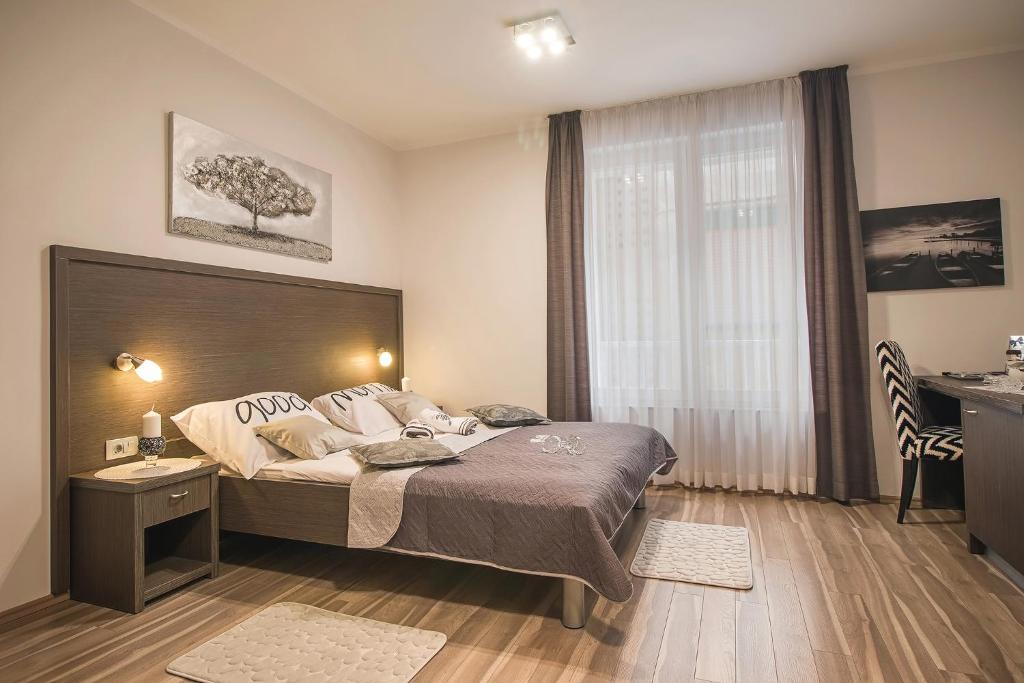 Łóżko lub łóżka w pokoju w obiekcie Holiday Center Ivona
